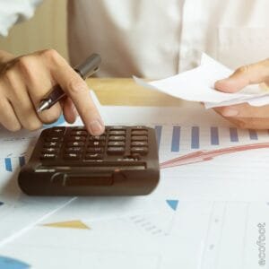 person using calculator for energy upgrade cost estimate