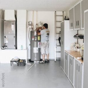 A licensed installer is replacing an old hot water system (water heater installation) in a commercial premises with a compliant energy-efficient unit that is eligible for VEU rebates.