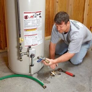 Water heater installation by a technician on a commercial property under the VEU rebate program.