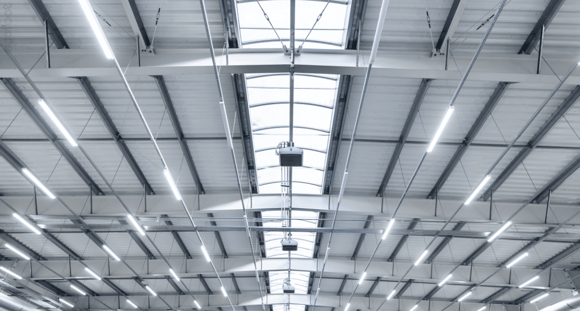 Industrial warehouse ceiling with advanced LED lighting upgrade, demonstrating improved energy efficiency and reduced maintenance costs.