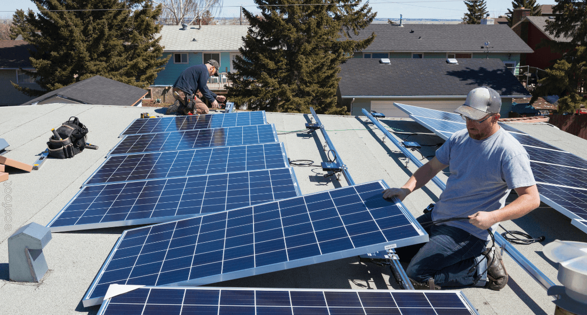 Technicians installing rooftop solar panels under Victoria Energy Upgrades program to promote energy-efficient homes and renewable energy in Australia.