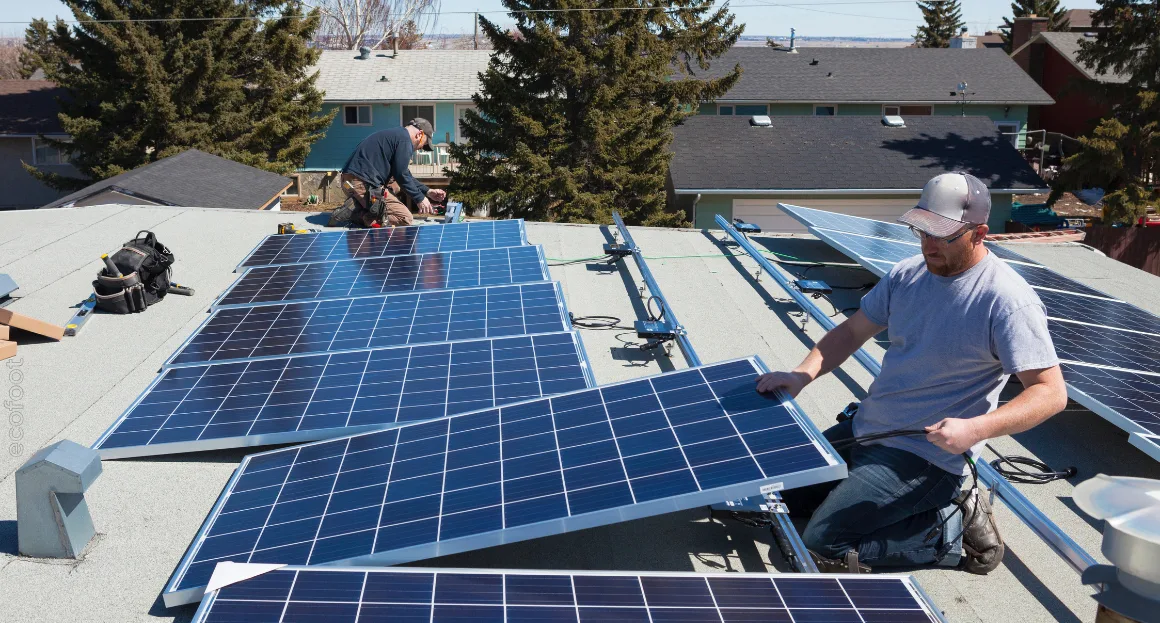 Technicians installing rooftop solar panels under Victoria Energy Upgrades program to promote energy-efficient homes and renewable energy in Australia.