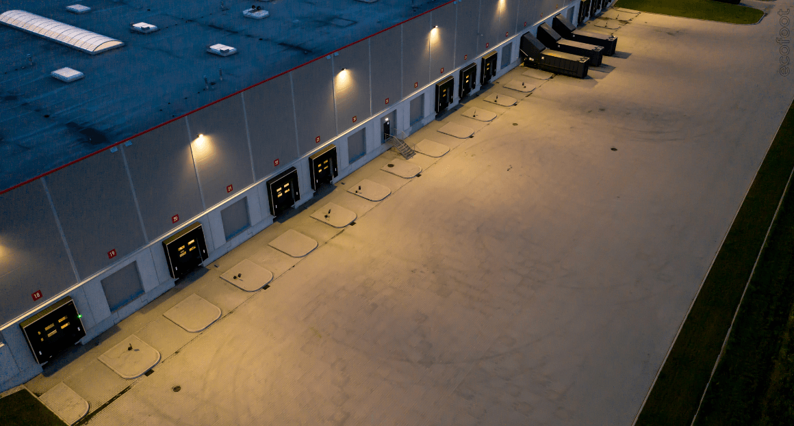 Commercial warehouse loading area illuminated with energy-efficient LED lights under the VEU program