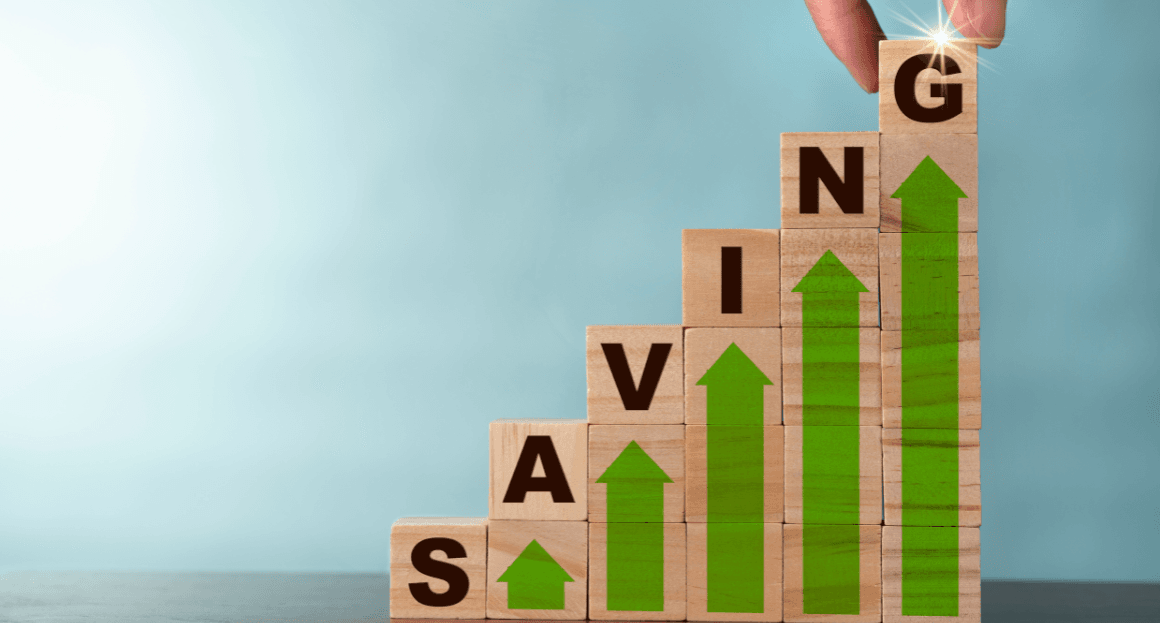 An image of wooden blocks spelling SAVING and green upward arrows representing energy savings.