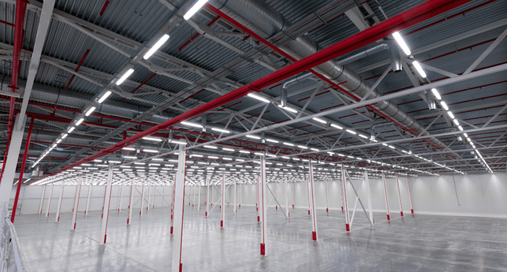 LED lighting installed across a large commercial warehouse ceiling, showcasing energy-efficient lighting suitable for retail and industrial spaces.